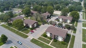 Indianola apartment for rent - an aerial view of a neighborhood of houses with cars parked on the street