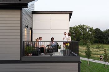 A group of people standing on a balcony
