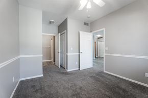 West Des Moines apartment for rent - A spacious room with a ceiling fan and carpeted floor.at Diamond Brooke, West Des Moines, IA 50266  