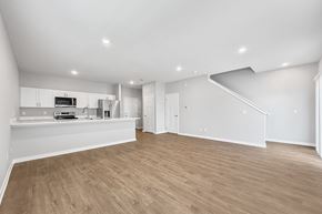 La Vista apartment for rent - A spacious, empty room with wooden flooring and white walls.