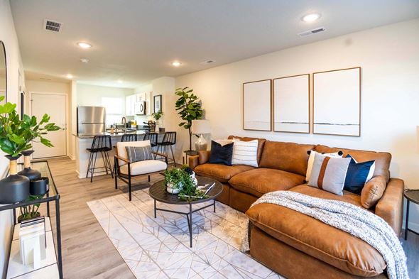 Pleasant Hill apartment for rent - a living room with a couch and a table at Forge65, Iowa, 50327