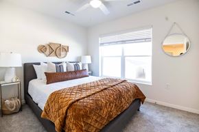 Pleasant Hill apartment for rent - a bedroom with a bed and a window at Forge65, Pleasant Hill, IA, 50327