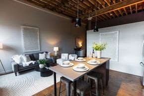 Newton apartment for rent - A dining area with a table set for two.at Plant 1 Lofts, N. Newton, IA 50208  