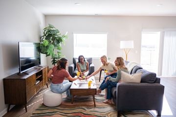 La Vista apartment for rent - Four women are sitting on a couch in a living room.