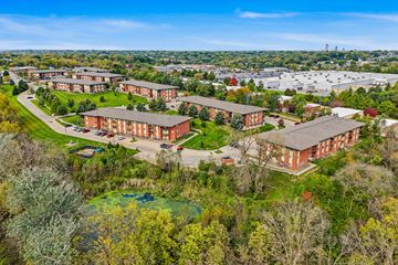 Des Moines apartment for rent - A large building complex surrounded by trees.