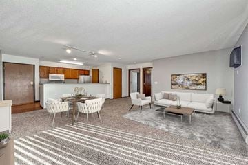 Sioux Falls apartment for rent - A living room with a dining table and chairs.