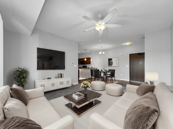 Clive apartment for rent - a white living room with couches and a coffee table at Stonegate Crossing Apartments, IOWA, 50325