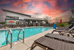 Ankeny apartment for rent - our apartments have a large swimming pool and lounge chairs at Lake Shore Place Apartments, Ankeny, Iowa
