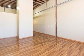 Des Moines apartment for rent - A room with wooden flooring and white walls.at Riverpoint Lofts, Des Moines