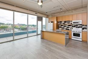 Des Moines apartment for rent - A kitchen with a view of the city.at City Square Lofts, Des Moines, IA 50309  