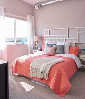 Des Moines apartment for rent - a bedroom with a bed and pillows and a window at Vue Apartments, IA, 50309