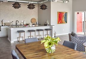 Des Moines apartment for rent - a dining room with tables and chairs and potted plants at Vue Apartments, Iowa, 50309