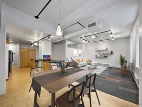 Des Moines apartment for rent - A modern kitchen with a dining table and chairs at The Des Moines Building Apartments, Des Moines, IA, 50309