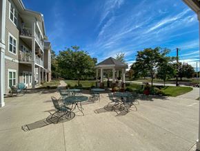Johnston apartment for rent - A sunny day at the outdoor seating area of a residential building.at Cornerstone Commons, Johnston, IA  