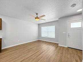 Bondurant apartment for rent - A room with a ceiling fan and wooden flooring.at Hawthorne Pointe, Iowa  