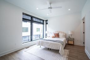 Des Moines apartment for rent - a bedroom with a bed and a large window at Matilda 235 Townhomes, Des Moines