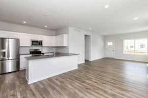 West Des Moines apartment for rent - A modern kitchen with wooden floors and stainless steel appliances. at Two Rivers Home Rentals, West Des Moines, 50266