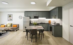 Waterloo apartment for rent - A modern kitchen with a dining table set for two.