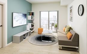 Waterloo apartment for rent - A modern living room with a grey sofa and a TV on the wall.