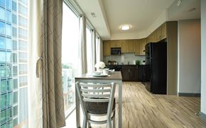 Waterloo apartment for rent - A modern kitchen with a dining table and chairs.