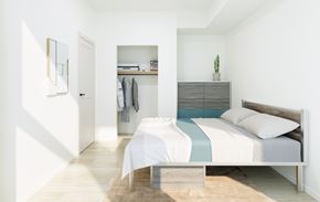 Waterloo apartment for rent - A bedroom with a bed, a wardrobe, and a mirror on the wall.