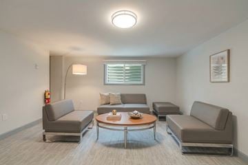 Waterloo apartment for rent - A living room with grey couches and a coffee table.