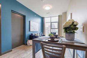Waterloo apartment for rent - a dining room with a table and chairs and a window