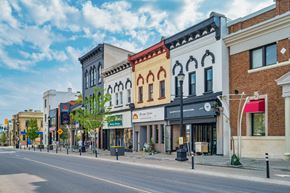 Waterloo apartment for rent - A street view of a small town with buildings on both sides.