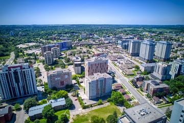 Waterloo apartment for rent - A cityscape with a mix of residential and commercial buildings.