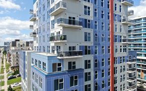 Waterloo apartment for rent - a blue and white building with balconies in a city