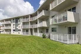 Cutler Bay apartment for rent - an image of an apartment building with a grassy yard