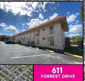 Miami Springs apartment for rent - a picture of a building in a parking lot