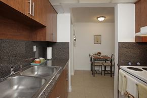 Oakland Park apartment for rent - a view of a kitchen and a dining room with a table