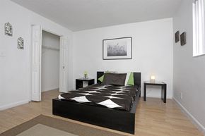 Oakland Park apartment for rent - a bedroom with a bed and a window and a closet