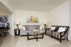 Oakland Park apartment for rent - A living room with a couch, chair, and coffee table.