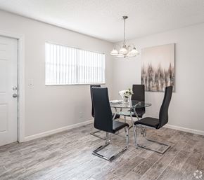 Boca Raton apartment for rent - A dining room with a glass table and two chairs.