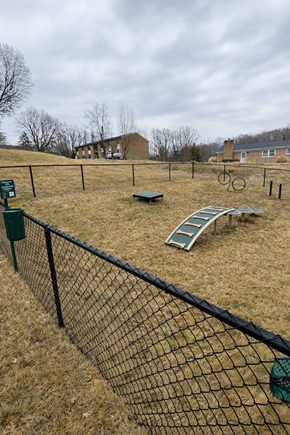 Staunton apartment for rent - A playground with a slide and a fence.