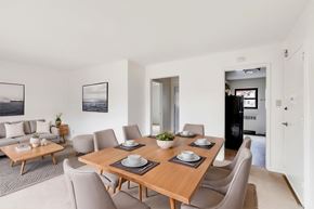 Albany apartment for rent - A dining room with a wooden table set for six.