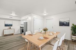 Staunton apartment for rent - A dining room with a wooden table and white chairs.