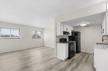 Fort Myers apartment for rent - A kitchen with white appliances and cabinets.
