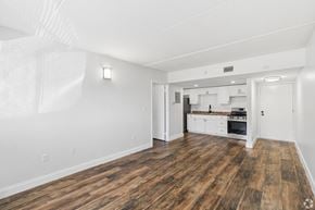 Merritt Island apartment for rent - A large empty room with wooden floors and white walls.