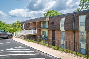Staunton apartment for rent - A parking lot with a building in the background.