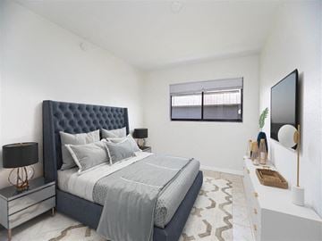Fort Myers apartment for rent - a bedroom with a bed and a tv