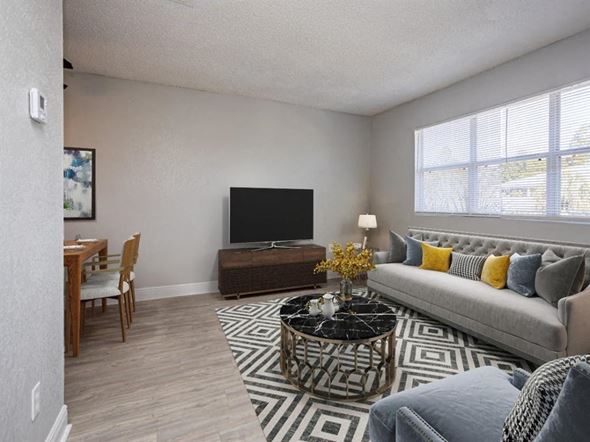 Milton apartment for rent - a living room with a couch and a television