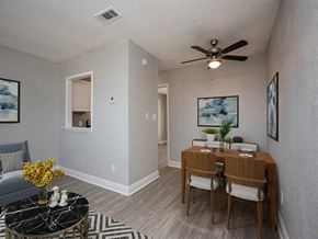 Milton apartment for rent - a dining room with a table and a ceiling fan