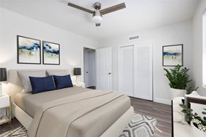Titusville apartment for rent - a bedroom with a bed and a ceiling fan