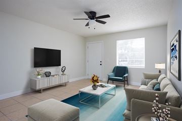 Titusville apartment for rent - a living room with a couch and a ceiling fan