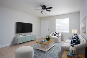 Titusville apartment for rent - a living room with a ceiling fan and a tv