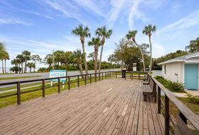 Titusville apartment for rent - the deck is overlooking the water and palm trees