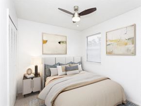 Macon apartment for rent - a bedroom with a bed and a ceiling fan